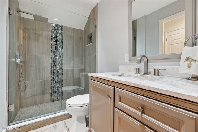 bathroom with tile patterned flooring, vanity, toilet, and curtained shower