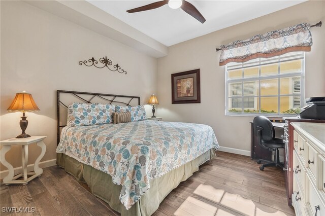 bedroom featuring ceiling fan and hardwood / wood-style flooring