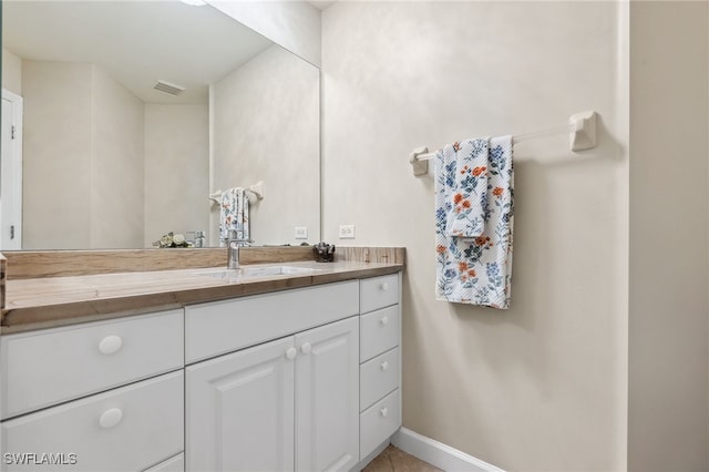 bathroom with vanity and baseboards