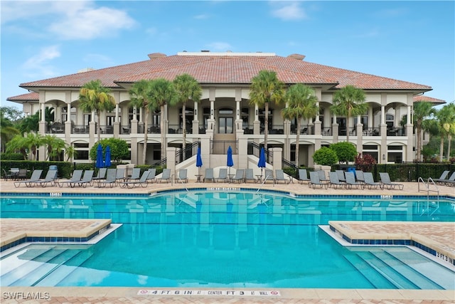 pool featuring a patio and fence