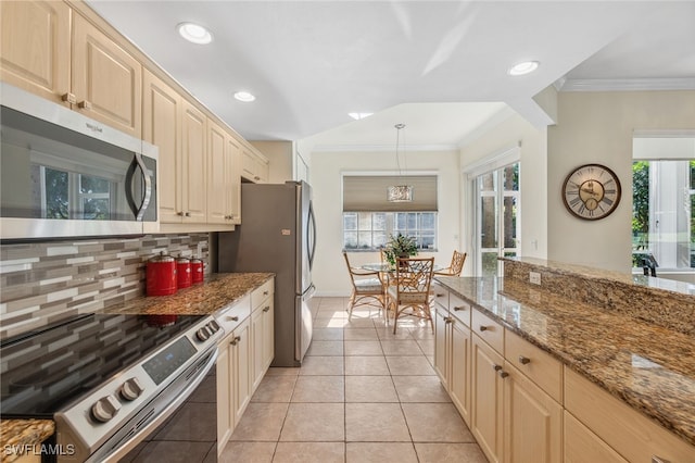 kitchen featuring appliances with stainless steel finishes, tasteful backsplash, light stone counters, light tile patterned floors, and pendant lighting