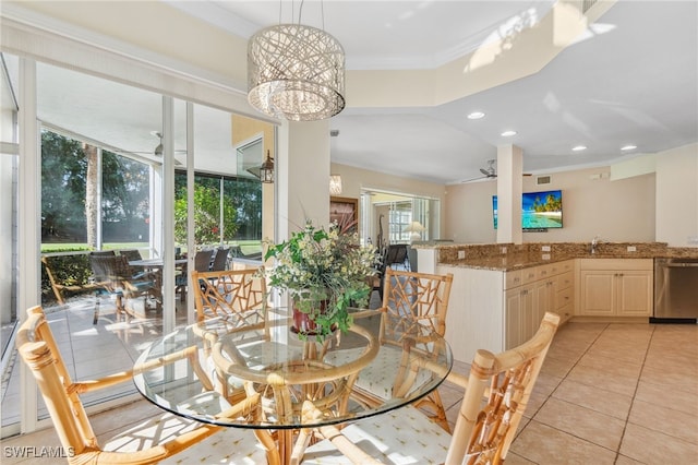 dining area with light tile patterned floors, recessed lighting, ceiling fan with notable chandelier, and ornamental molding