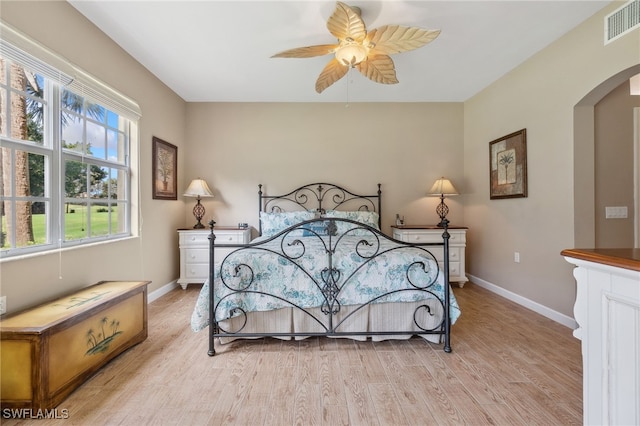 bedroom with ceiling fan and light wood-type flooring