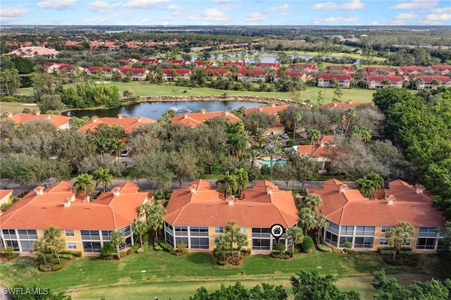 birds eye view of property with a water view and a residential view