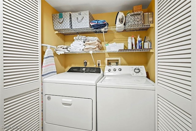 laundry room with washer and dryer