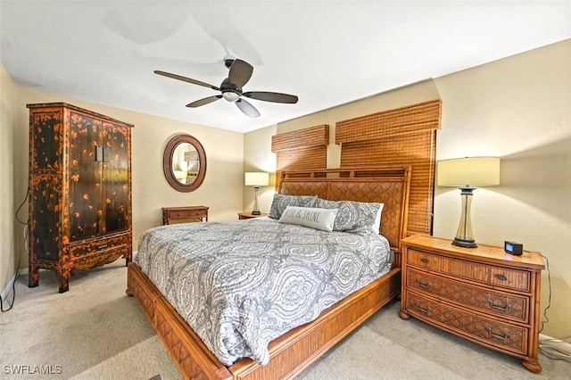 bedroom with light carpet and ceiling fan