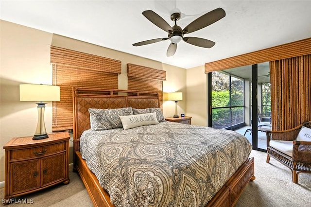 carpeted bedroom featuring ceiling fan and access to outside