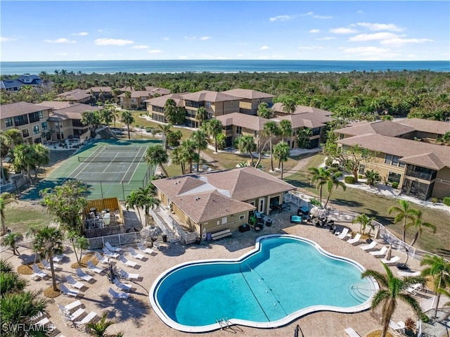 view of swimming pool with a water view