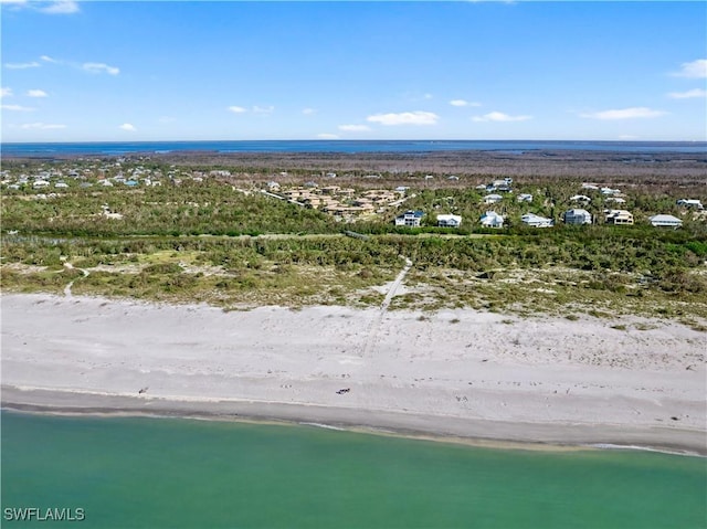 bird's eye view with a beach view and a water view