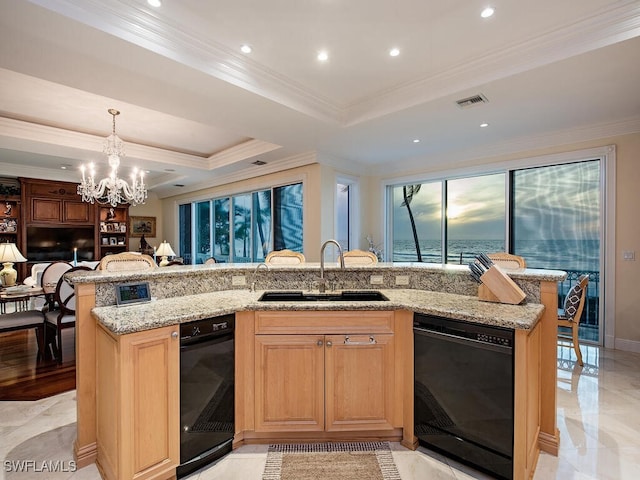 kitchen with sink, black dishwasher, crown molding, an island with sink, and a tray ceiling