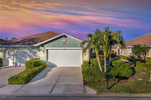 single story home featuring a garage