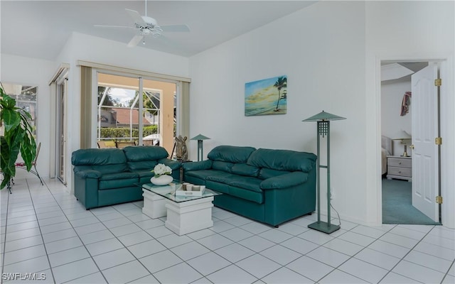 living room with ceiling fan and light tile patterned floors