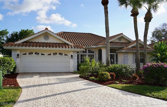 view of front of home with a garage