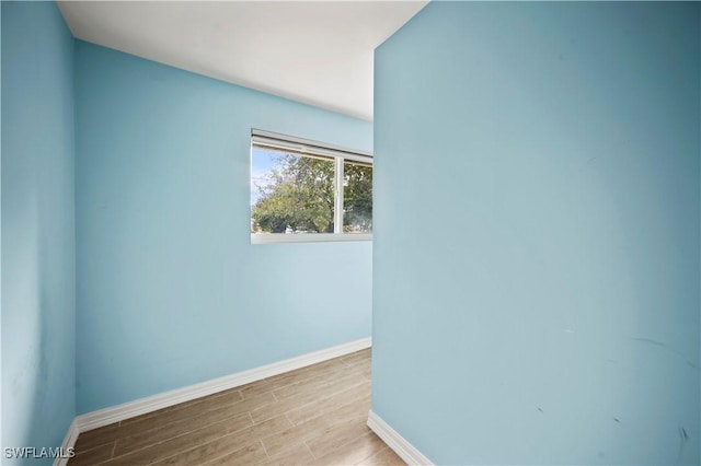 spare room with light wood-type flooring