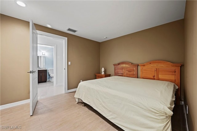 bedroom with light wood-type flooring