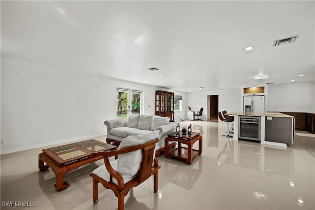 tiled living room featuring beverage cooler