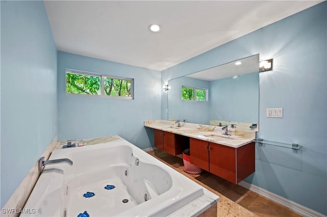 bathroom featuring vanity and a relaxing tiled tub