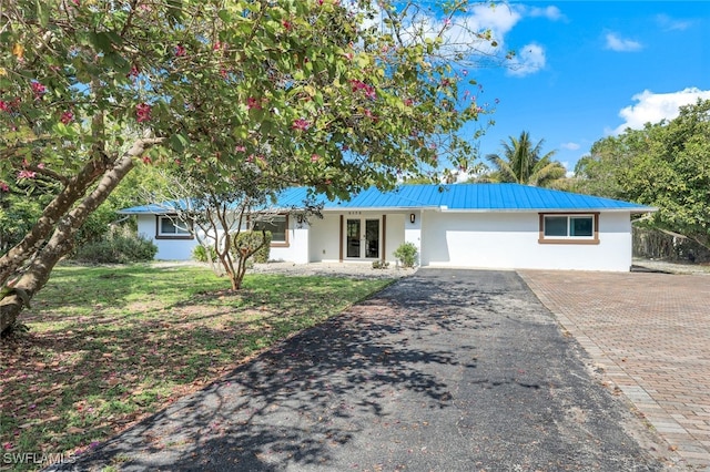 single story home featuring a garage