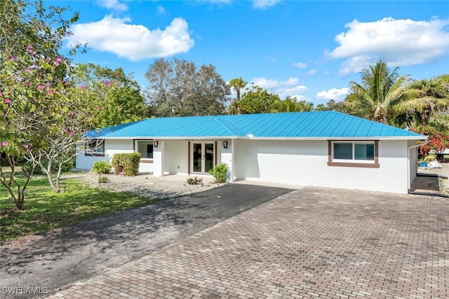 ranch-style house featuring a garage