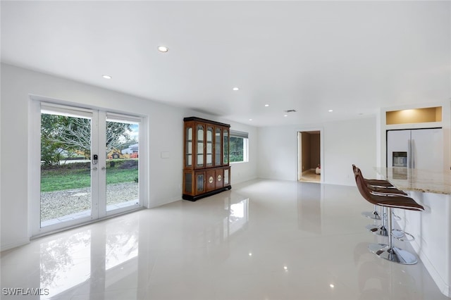 unfurnished living room with french doors