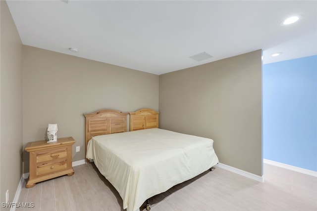 bedroom with light hardwood / wood-style floors