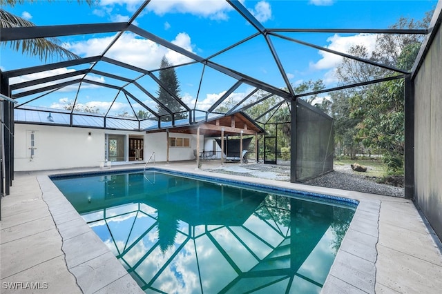 view of pool featuring a lanai and a patio