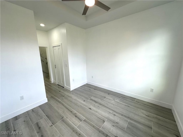 spare room with ceiling fan and light hardwood / wood-style floors