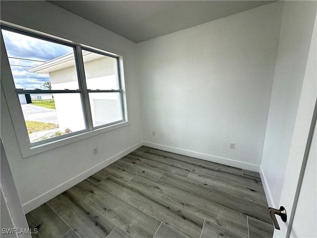 spare room featuring hardwood / wood-style floors