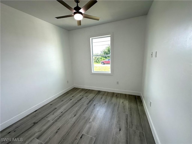 empty room with ceiling fan and light wood-type flooring