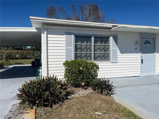 exterior space with a carport