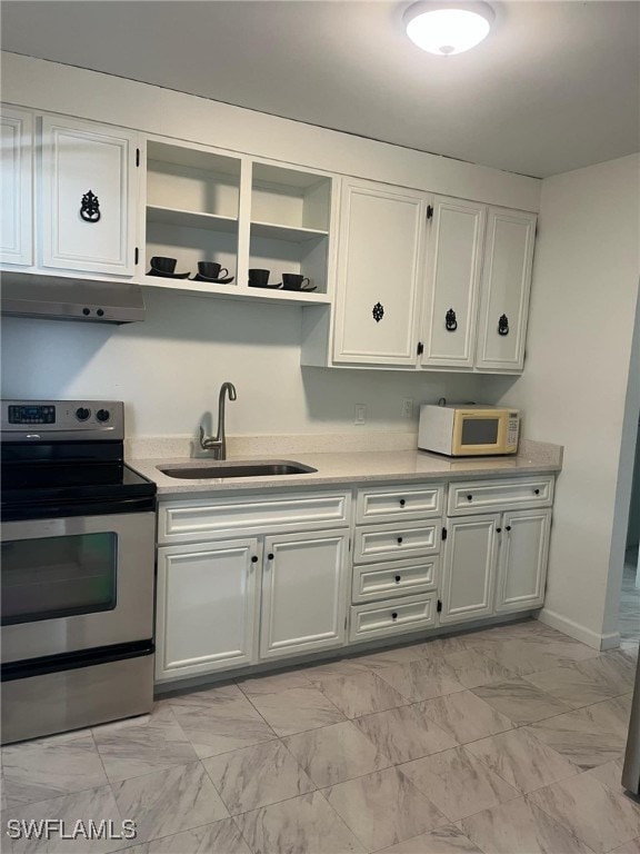 kitchen with electric range, white cabinetry, sink, and extractor fan