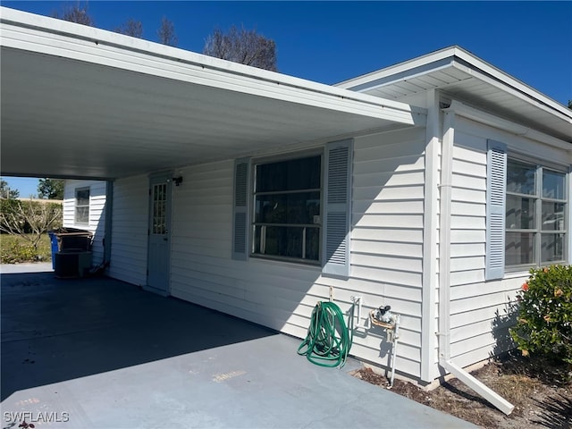 view of side of property featuring a carport