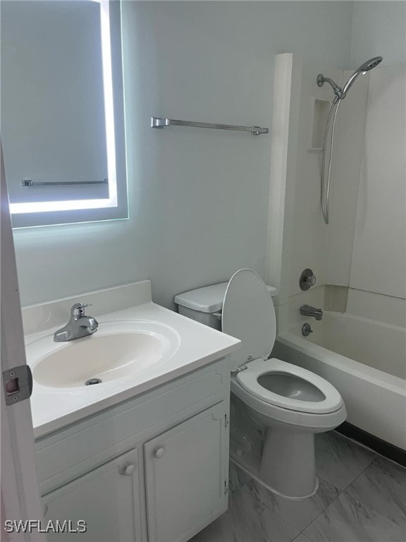 full bathroom featuring bathing tub / shower combination, vanity, and toilet