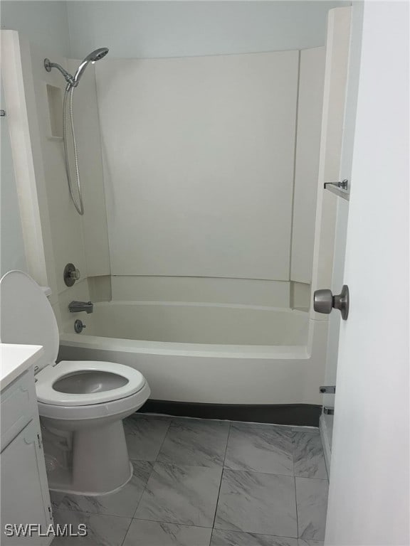 full bathroom featuring vanity, toilet, and  shower combination