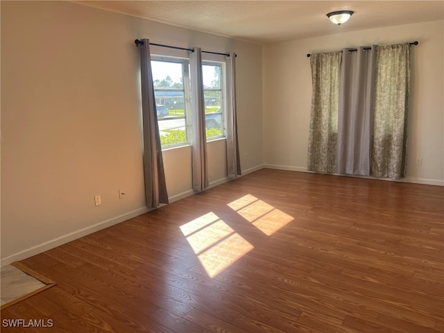 empty room with wood-type flooring