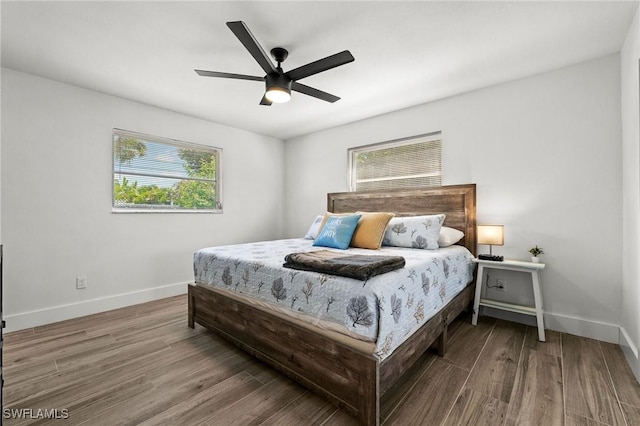 bedroom featuring hardwood / wood-style floors and ceiling fan