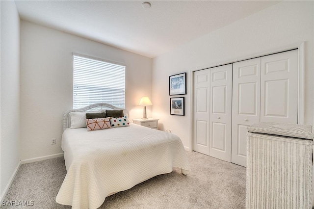 carpeted bedroom with a closet