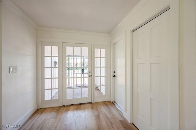 doorway to outside with crown molding and light hardwood / wood-style flooring