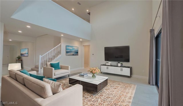 living room featuring a towering ceiling