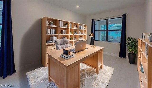 office space with light hardwood / wood-style flooring