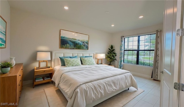 bedroom with light tile patterned floors