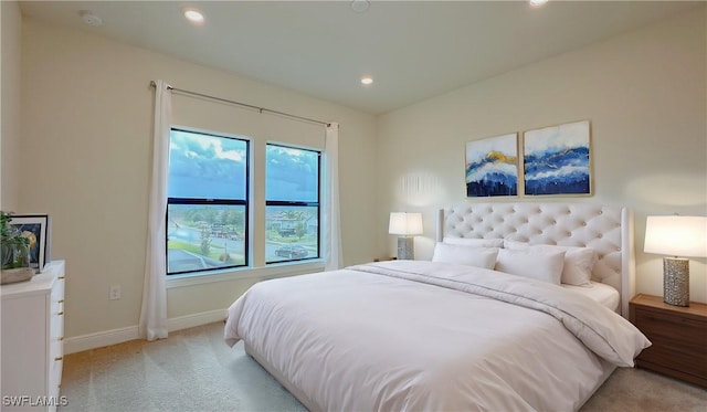 bedroom featuring light colored carpet