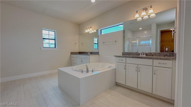 bathroom with independent shower and bath, tile patterned flooring, and vanity