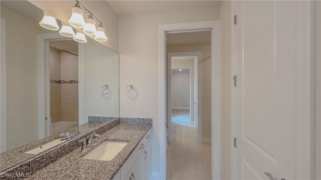 bathroom with vanity and an inviting chandelier