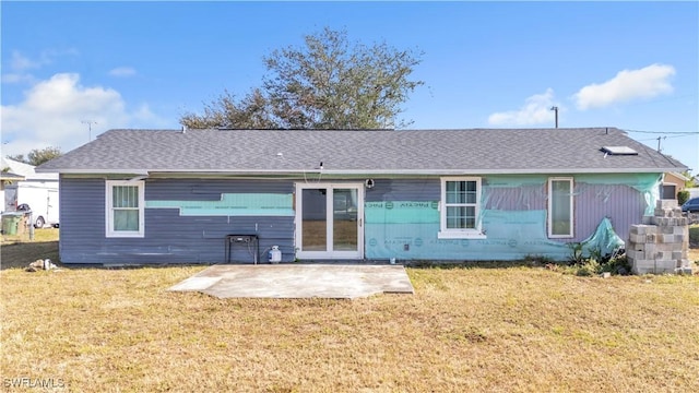 back of house featuring a patio and a lawn