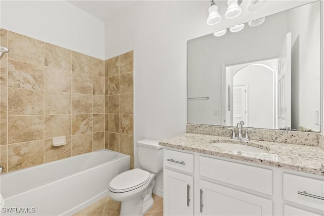 full bathroom featuring tile patterned flooring, vanity,  shower combination, and toilet