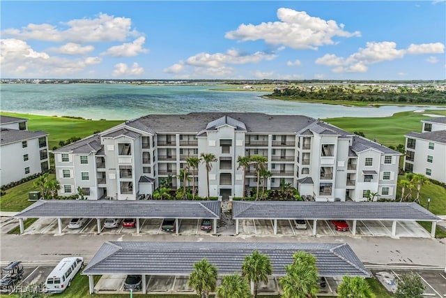 birds eye view of property featuring a water view