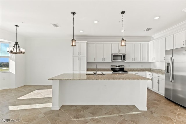 kitchen with white cabinetry, sink, an island with sink, decorative light fixtures, and appliances with stainless steel finishes