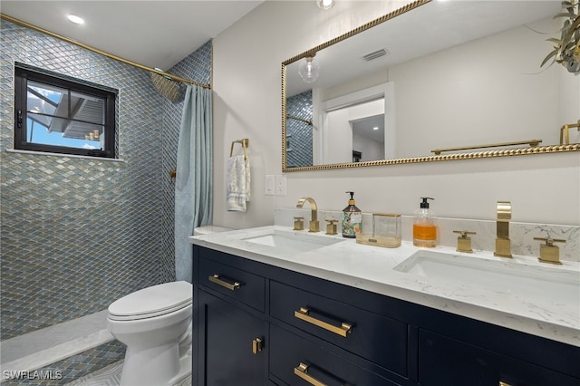 full bathroom with visible vents, a sink, toilet, and tiled shower