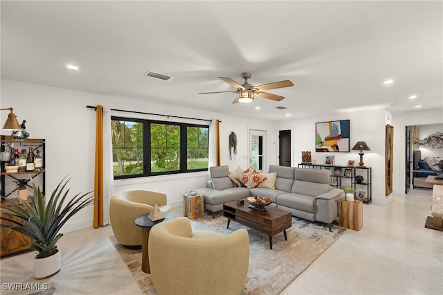 living room featuring visible vents, light speckled floor, a ceiling fan, and recessed lighting